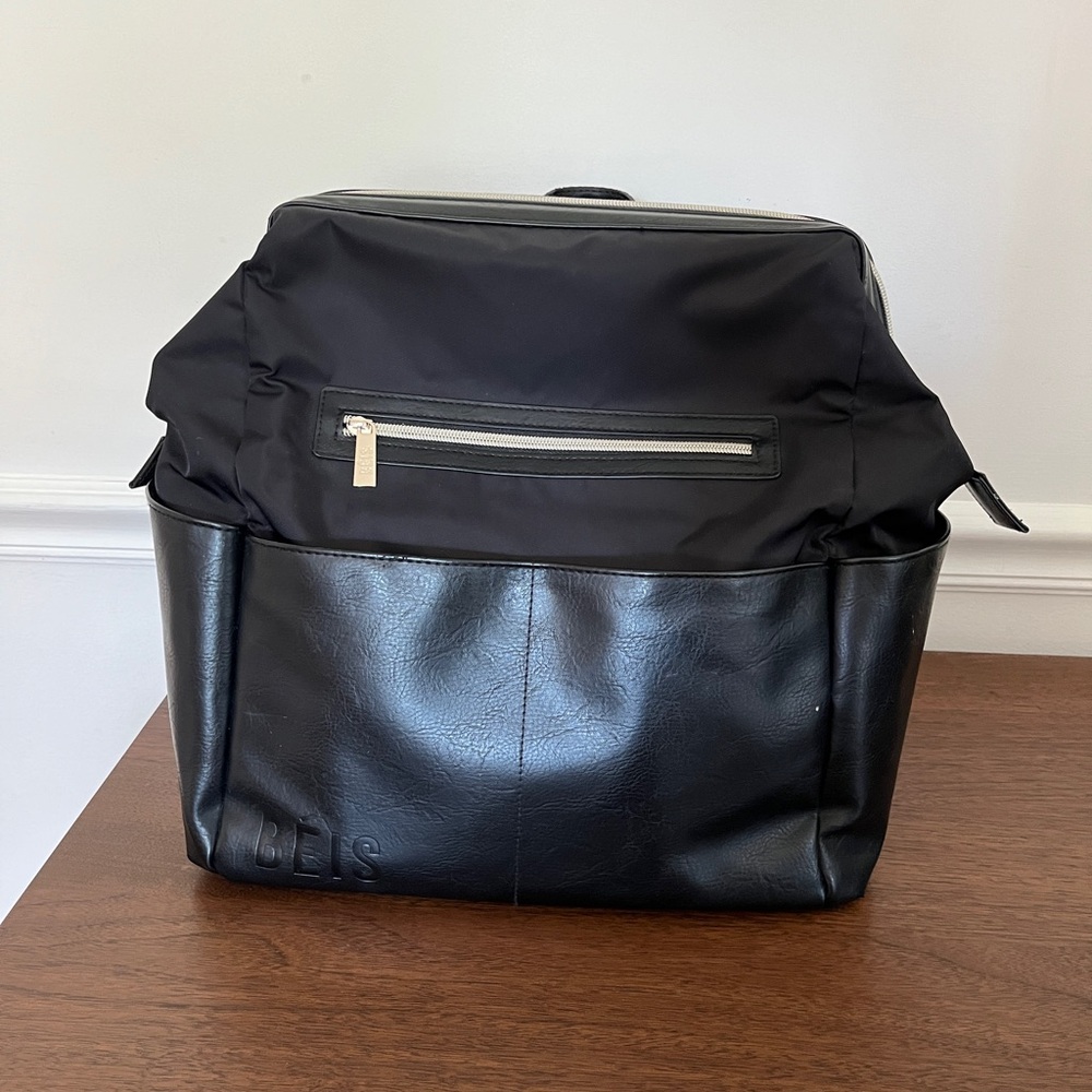 The Backpack Diaper Bag 
in Black: EUC